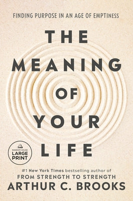 Paperback book "The Meaning of Your Life" by Random House, featuring a thoughtful cover design on a wooden surface.