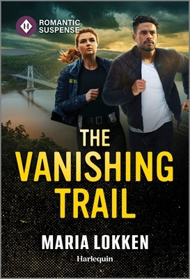 Mass market paperbound book "The Vanishing Trail" by Harlequin Romantic Suspense on a wooden table with a blurred background.