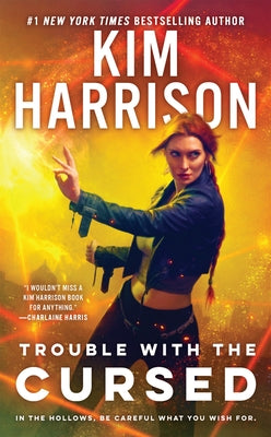Paperback edition of "Trouble with the Cursed" by Penguin Publishing Group, featuring a colorful book cover design.
