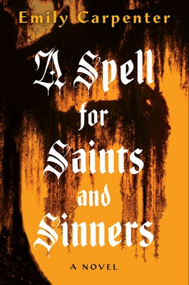 Paperback copy of "A Spell for Saints and Sinners" by Kensington Publishing Corporation on a wooden surface.